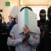 FILE - The defendants hide their faces behind file folders on their way to the courtroom in the District Court in Wiener Neustadt, Austria, where two terror suspects will stand trial Tuesday, one for plotting to carry out an attack on one of superstar singer Taylor Swift's concerts in Vienna in August 2024 and pledging allegiance to the Islamic State group, Tuesday, April 28, 2026. (AP Photo/Matthias Schrader, File)