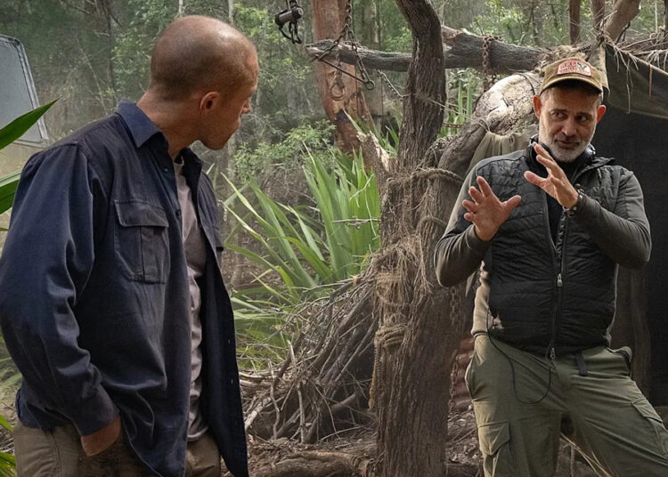 (L-R) Taron Egerton and Baltasar Kormákur on set of 'Apex.'Credit: KANE SKENNAR/NETFLIX