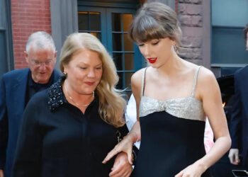 Two women walking together on a city street.