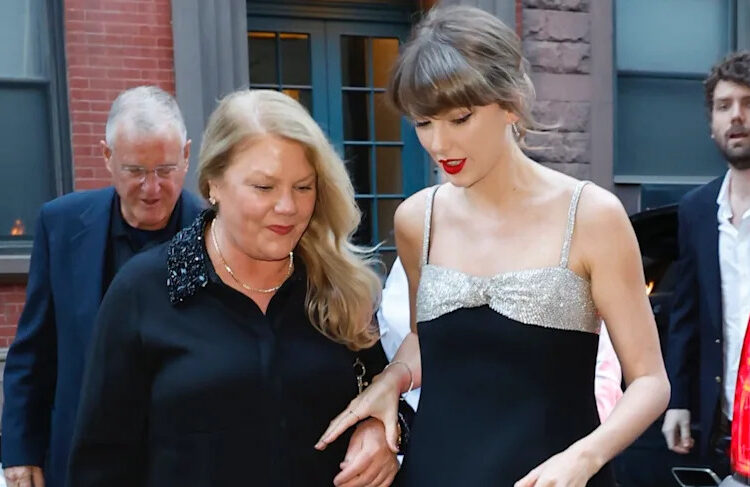 Two women walking together on a city street.