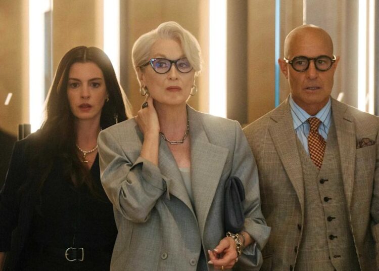 Anne Hathaway as Andrea Sachs, Meryl Streep as Miranda Priestley, and Stanley Tucci as Nigel in The Devil Wears Prada 2