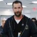 Noah Wyle's  Dr. Michael Robinavitch stands in the ER with hsi staff working in the background in The Pitt