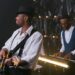 A guitarist and pianist performing at a jazz show