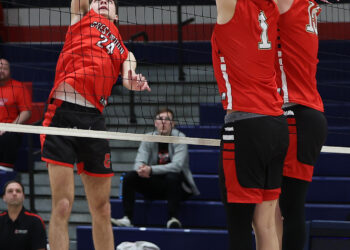 Crestwood’s JJ Stec (24) tries to send the ball past...