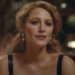 Blake Lively looking forward while wearing a top with black leather straps in It Ends With Us.