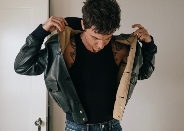 person wearing a jacket and showing their upper body