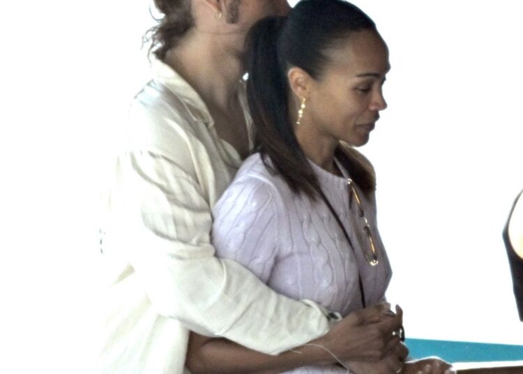 Perego and Saldana were photographed hugging as they chatted with their friends