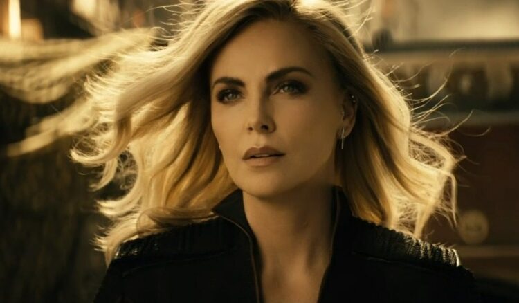 Charlize Theron stands with wind blowing in her hair in The Boys