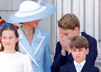 George sneezes as his mother looks on at this year's Trooping event