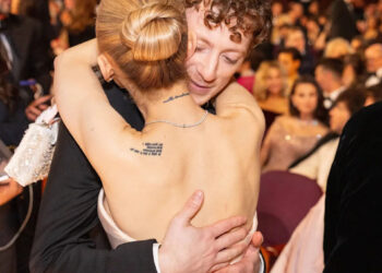 Ethan Slater and Ariana Grande at the 2025 Oscars