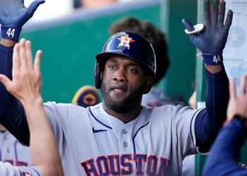 Houston Astros' Yordan Alvarez celebrating in the dugout