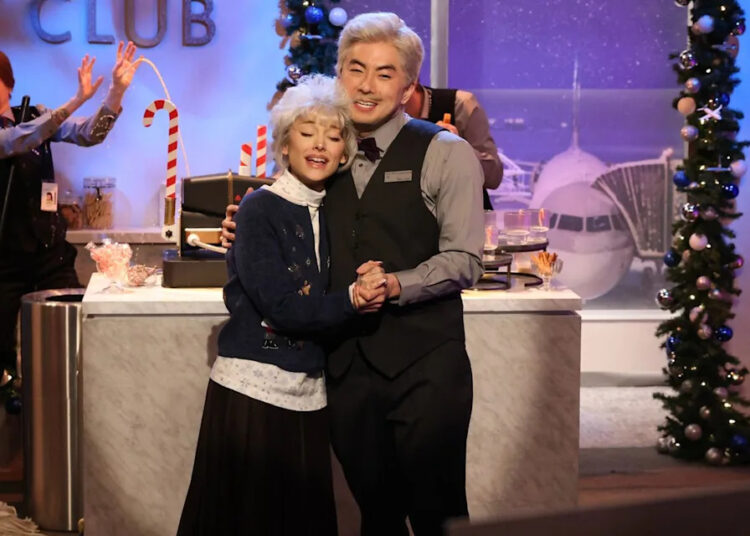 Host Ariana Grande and Bowen Yang during the