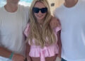 Sean Preston, Britney Spears and Jayden James smiling together on a boat.