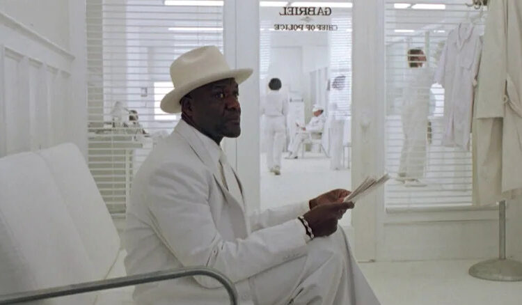 Jackson in white in Gabriel's office in A Life Less Ordinary