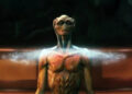 An alien standing in a ring of light in The Arrival