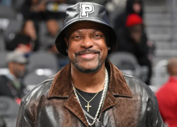 ATLANTA, GEORGIA - MARCH 10: Actor Chris Tucker attends the game between the Philadelphia 76ers and the Atlanta Hawks at State Farm Arena on March 10, 2025 in Atlanta, Georgia.