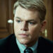 Matt Damon's Francois Pienaar looks serious as he sits in a suit in Invictus
