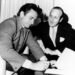 Clive Davis, then a lawyer at Columbia Records, with Johnny Cash as he signs a record contract around 1960, seven years before Davis would become president of the record label.