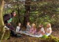 Pictured is Robyn Whelan age 10 and Tuireann Whelan age 5 from Faha with sisters Erika Harrington age 6, Klara Harrington age 9 and Eva Whelan Kelleher age 9 from Tramore as they enjoy a magical seanchaí session with Bachelor In Trouble Tom Coffey deep in the Comeragh woodlands as the full programme for Comeraghs Wild Festival 2026 was officially launched, unveiling a summer celebration of music, culture, storytelling and outdoor adventure across Waterford’s spectacular Copper Coast and Comeragh region. The festival is on offer across Waterford from July 9th to 12th, 2026