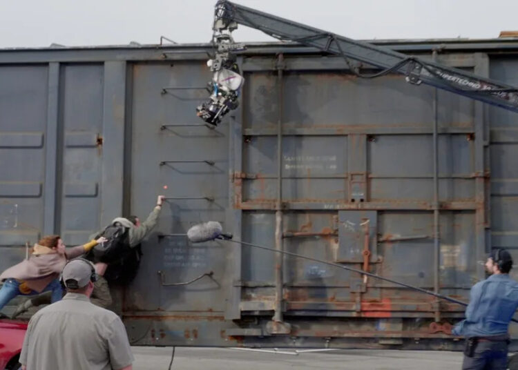 Emily Blunt and Josh O'Connor filming the train sequence in 'Disclosure Day.'