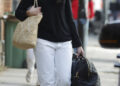 Dua Lipa headed to Italy in a bridal-white take on the white jeans trend