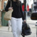 Dua Lipa headed to Italy in a bridal-white take on the white jeans trend