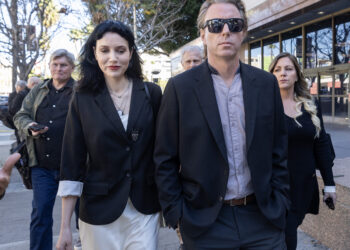 Elijah Blue Allman and Marieangela King leave a courthouse with their lawyers.