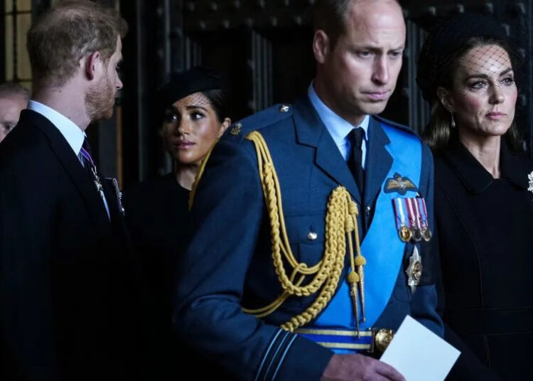 Britain's Prince William, Kate, Princess of Wales, Prince Harry, and Meghan, Duchess of Sussex, pay their respects to Queen Elizabeth II in Westminster Hall for the Lying-in State, in London, Wednesday, Sept. 14, 2022. - Emilio Morenatti/AP