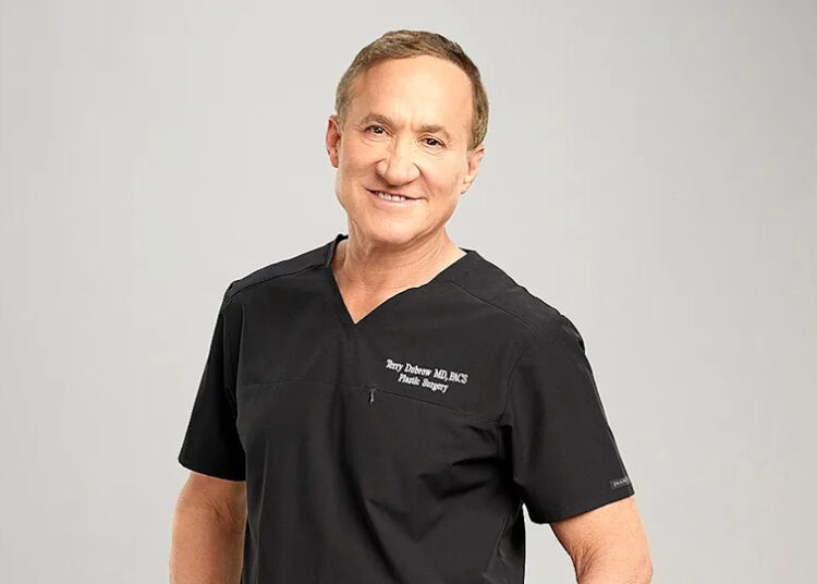 Dr. Terry Dubrow standing in a studio setting