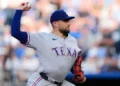 Texas Rangers starting pitcher Nathan Eovaldi throws during the first inning of a baseball game against the Kansas City Royals, Tuesday, June 9, 2026, in Kansas City, Mo. (AP Photo/Charlie Riedel)