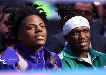 iShowSpeed wearing a blue jacket, KSI in a green jacket with a white bandana.