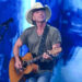 Kenny Chesney palying the guitar