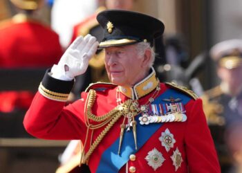 Britain's King Charles III salutes the troops outside Buckingham Palace during Trooping The Colour, the King's annual birthday parade, in London, Saturday, June 13, 2026.