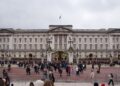 General view of Buckingham Palace with tourists gathering outside on February 19, 2026.