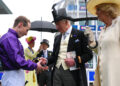 Jockey Rowan Scott is presented with a cap by the King (Carl Court/PA) (PA Wire)