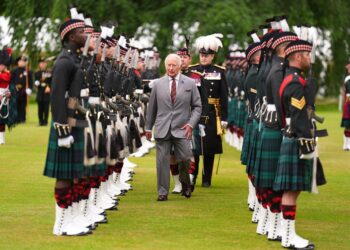Charles inspects the guard of honour provided by Balaklava Company, 5th Battalion, the Royal Regiment of Scotland (Aaron Chown/PA)