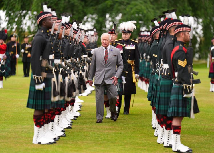 Charles inspects the guard of honour provided by Balaklava Company, 5th Battalion, the Royal Regiment of Scotland (Aaron Chown/PA)