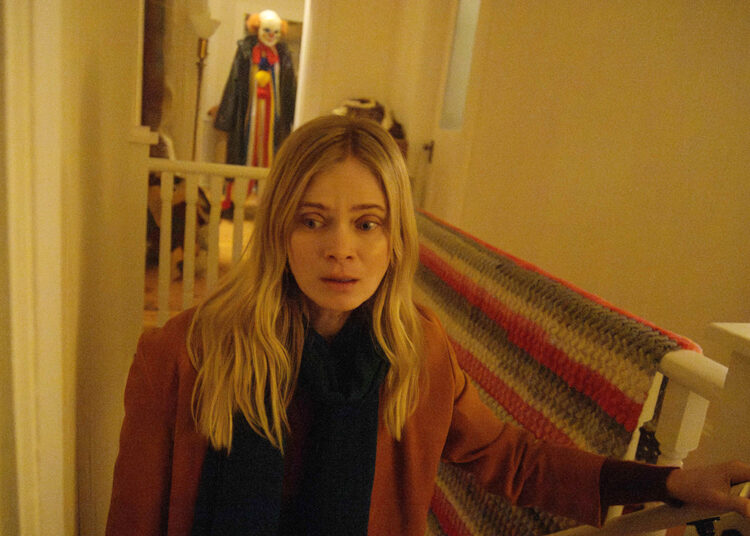 Elizabeth Helmer (Sara Paxton) is stalked by a killer clown in Lifetime's 'Killer Clown'