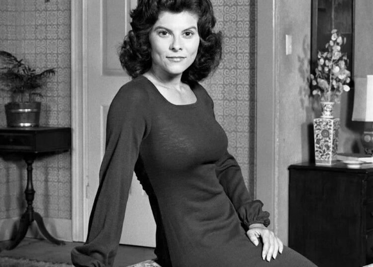 Adrienne Barbeau posing on the back of a sofa in 1972.