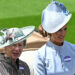Britain's Princess Anne, Princess Royal (L) and Harriet Sperling arrive by horse-drawn carriage on the first day of the Royal Ascot