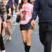 Olivia Rodrigo wore a graphic tee and leather mini skirt with an on-sale Coach bag