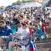 A large crowd of spectators keep their eyes to the sky for the aerobatics entertainment at the Texarkana Airshow on Saturday, June 27, 2026, at Texarkana Regional Airport. Besides the aerial displays, the show featured a musical concert, an exotic car exhibition, several vendors and tours of vintage military aircraft. (Staff photo by Stevon Gamble)