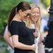 Anne Hathaway cradling baby bump june 2026