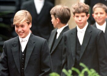 Prince William (now the Prince of Wales) leads his classmates to lessons on his first day at Eton School