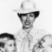 Peter Phillips, Princess Anne and Zara Tindall pose during Zara's christening in 1981. By: MEGA