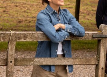 Queen Mary embraced countryside chic in a classic denim shirt and neutral separates during a visit to see the royal horses begin their summer holiday.