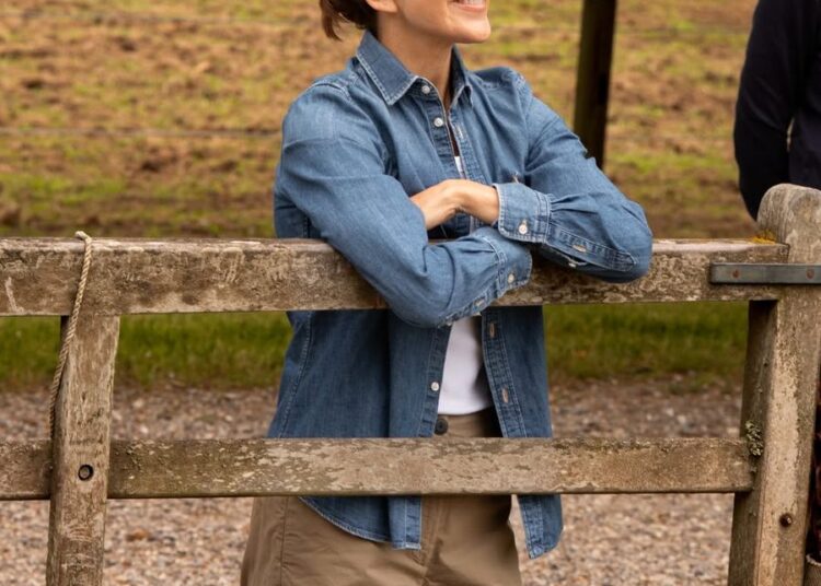 Queen Mary embraced countryside chic in a classic denim shirt and neutral separates during a visit to see the royal horses begin their summer holiday.