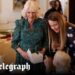 Queen unleashes children on table full of treats