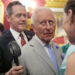 Vice Admiral Sir Tony Johnstone-Burt, Master of the Household to the Sovereign holds a small battery powered fan for King Charles III.<span> Credit: PA</span>