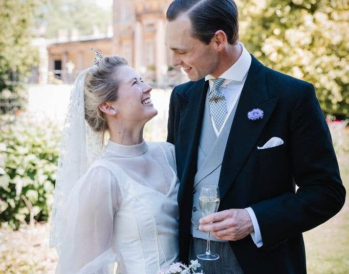 A photo of a bride and groom looking at each other